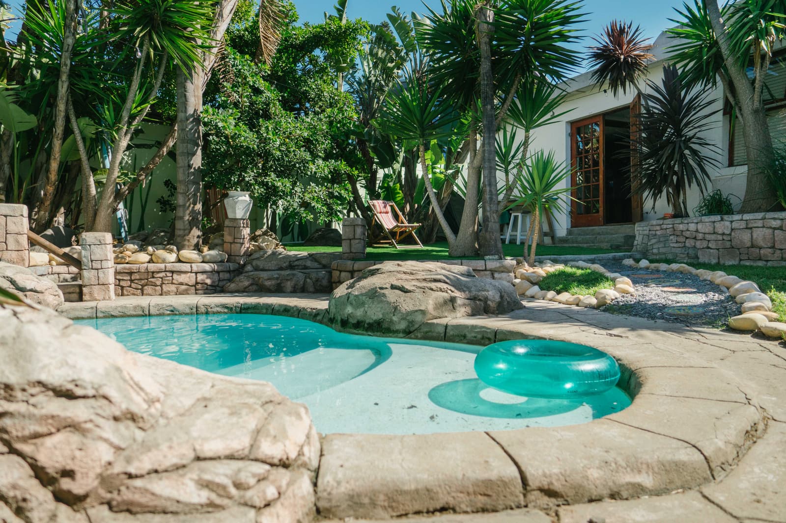 The pool and garden at Khaya on a sunny day, the cold plunge