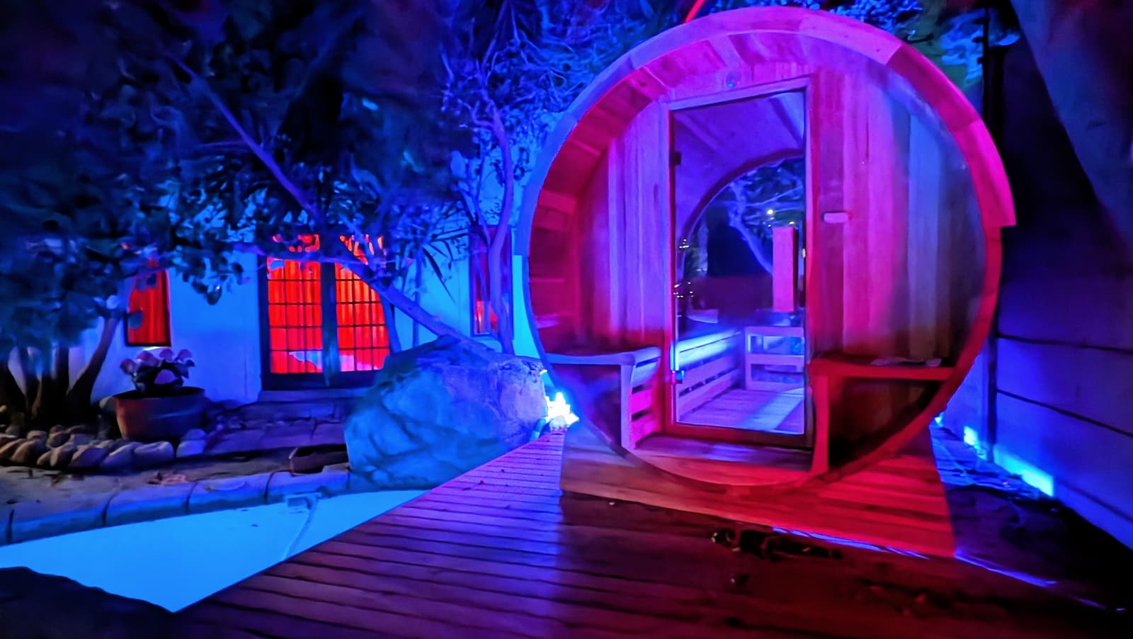 The barrel sauna at Khaya lit up in the evening, Bloubergstrand